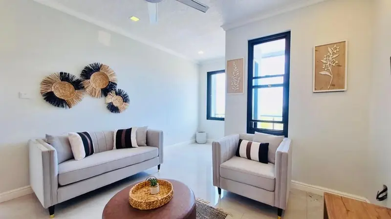Seating area with woven wall decor